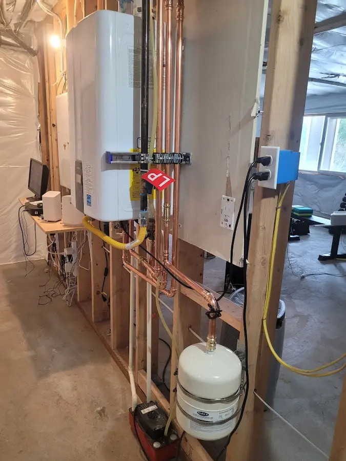Licensed plumber repairing a kitchen sink in Champion