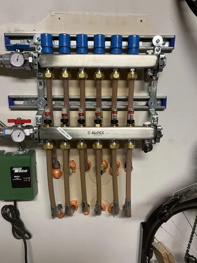 Plumber performing Water Heater Repair at a residential property in Champion